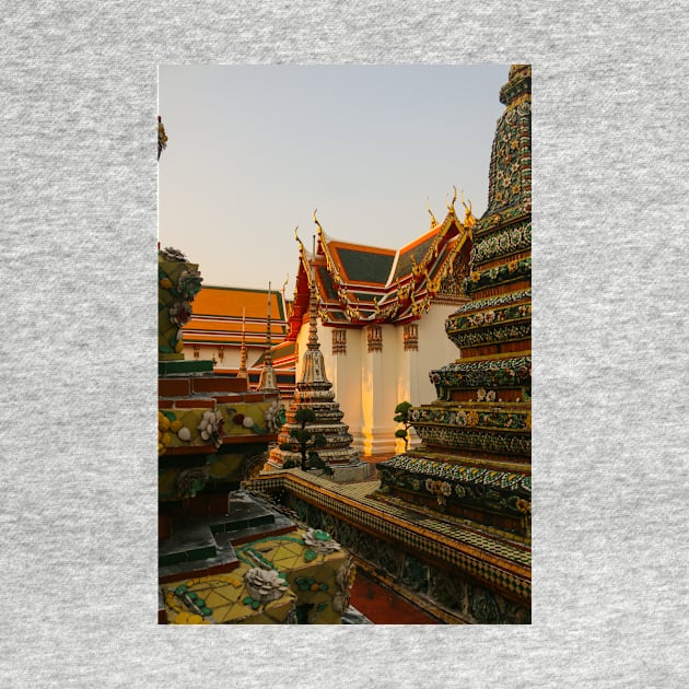 Fourth sidewalk view to ornate roof, flanked from parts of Chedis at Wat Pho. by kall3bu